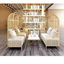 Factory direct sales size custom LOFT light luxury golden bird cage iron sofa hotel rest double sofa table and chair combination